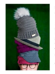 Woman wearing many hats