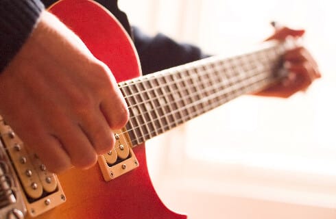 Man playing an acoustic guitar