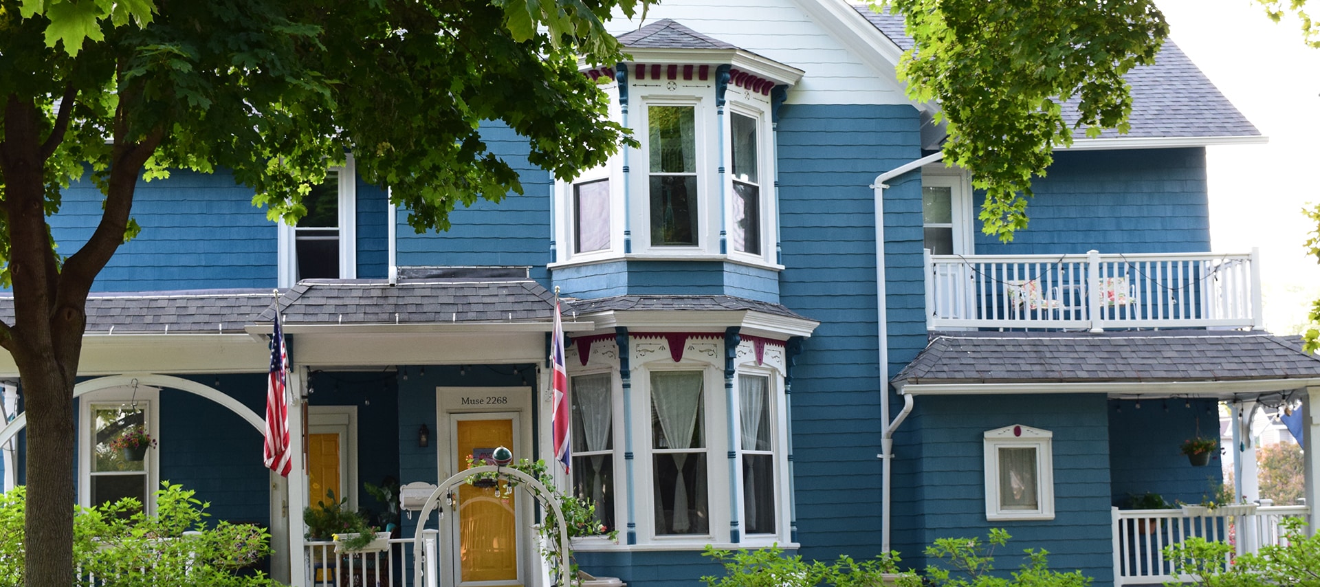 Exterior view of blue Victorian house