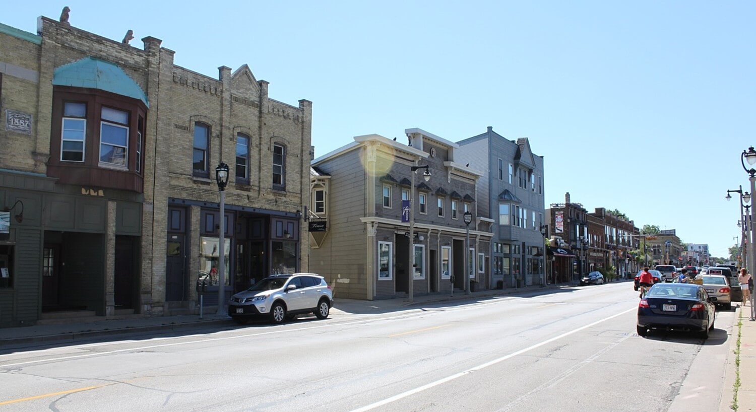 Long view down the street in MIlwaukee, WI, with historic buildings.