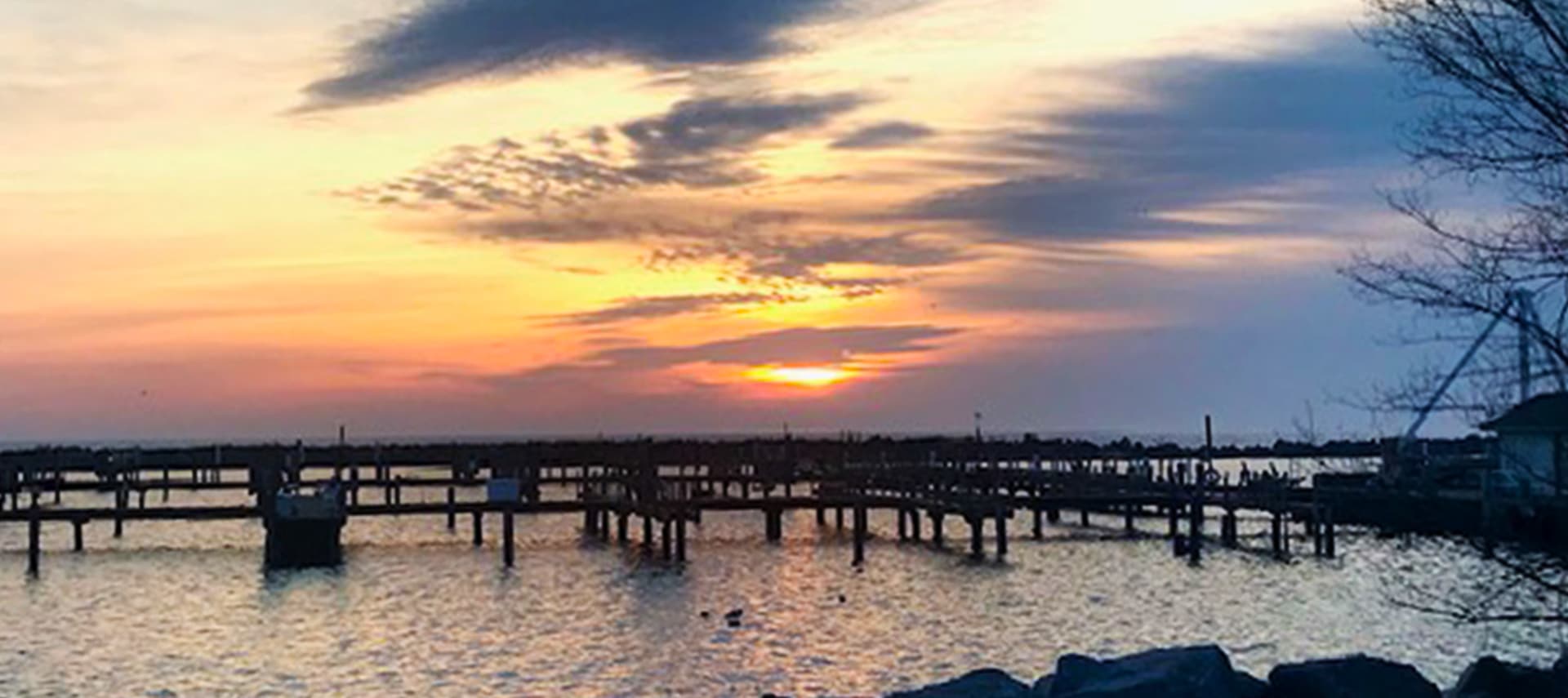 Sunrise over Lake Michigan with boat slips at South Shore Park