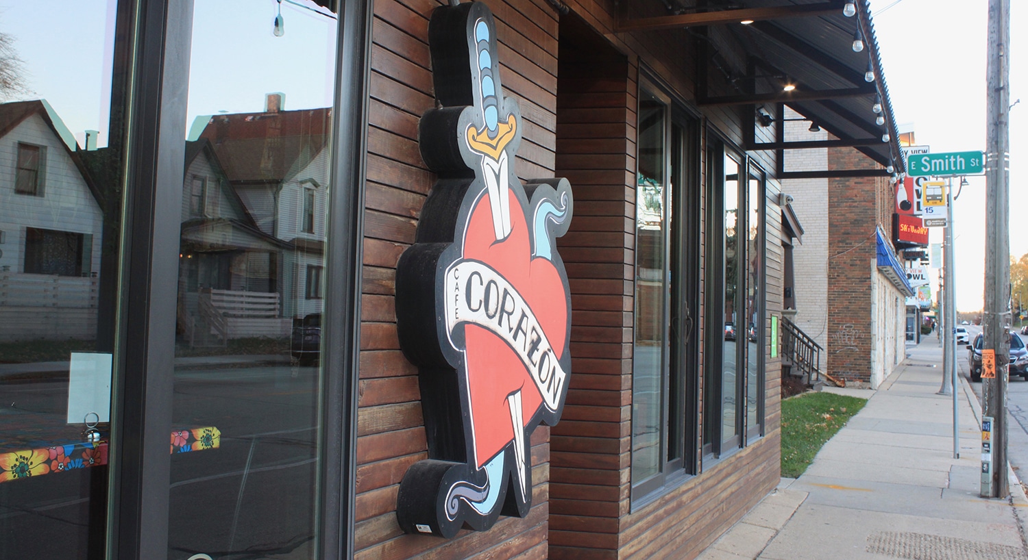 Exterior brick walls and windows and signage on Corazon Mexican restaurant on Kinnickinnic Avenue.