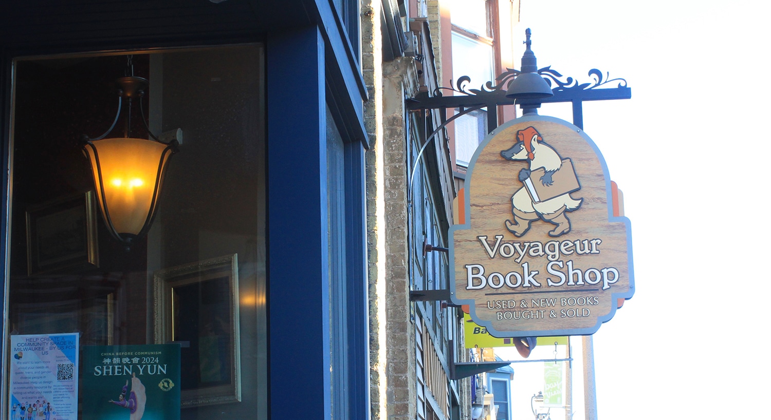 Hanging sign for Voyageur Bookshop on South Kinnickinnick Avenue.