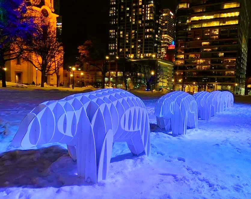 Picture of snow bear sculptures at night in blue light